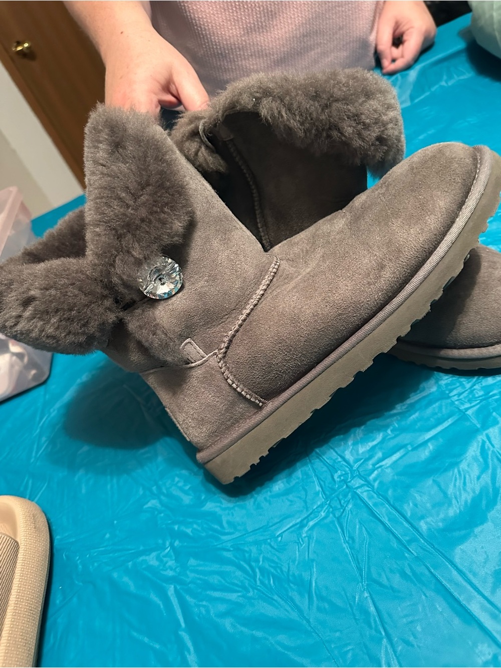Uggs. Cozy Gray Shearling Short Women's Ugg Boots with Decorative Button